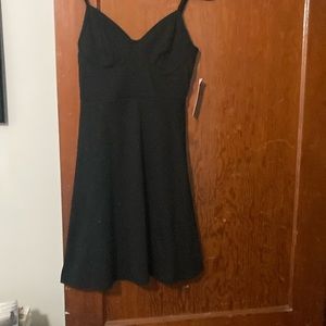 Knee length, thin straps, nice, never worn.